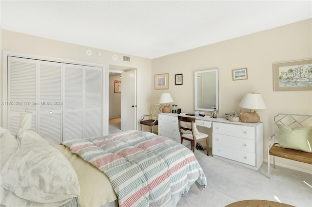 bedroom featuring light carpet, visible vents, and a closet