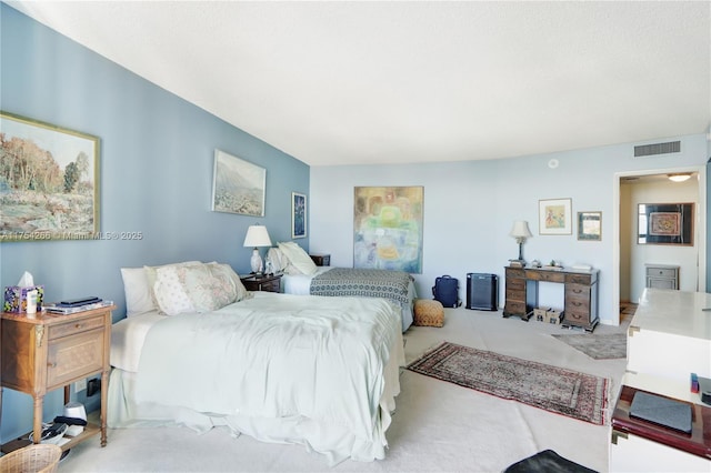 bedroom featuring visible vents