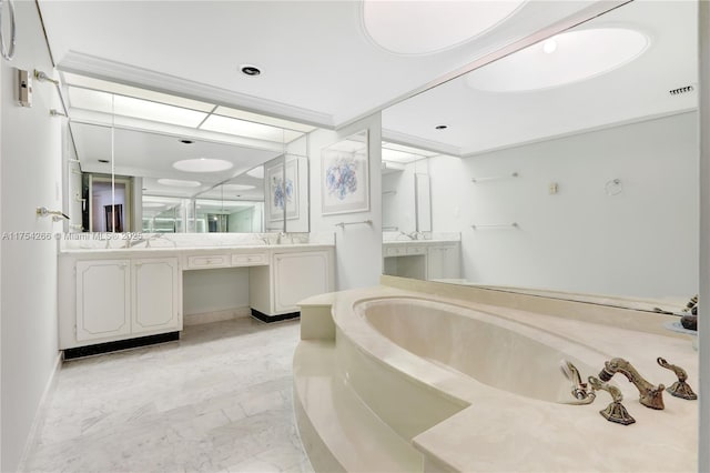 bathroom featuring visible vents, baseboards, a garden tub, marble finish floor, and vanity