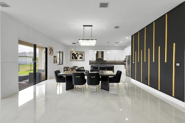 dining space featuring marble finish floor, visible vents, and recessed lighting