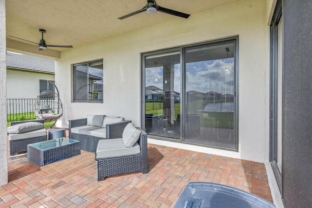 view of patio with ceiling fan, an outdoor living space, and fence