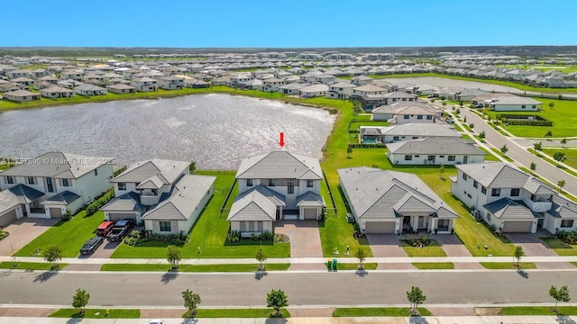 aerial view with a residential view and a water view