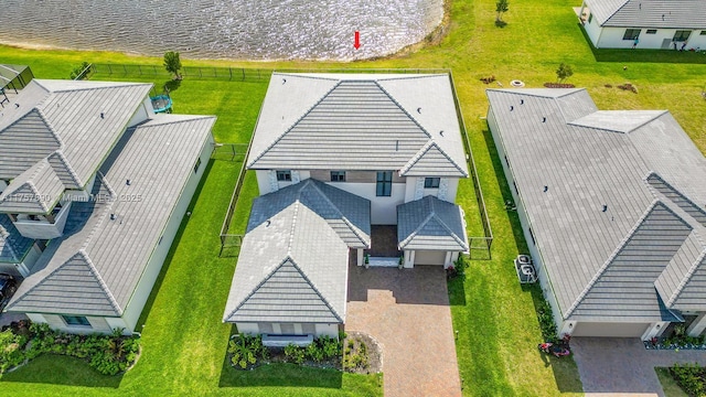 drone / aerial view featuring a water view and a residential view