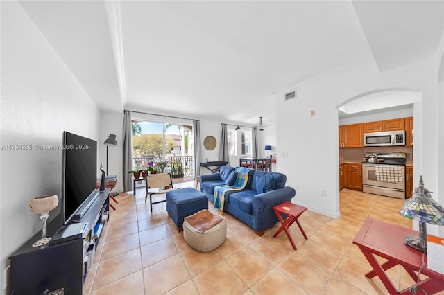 living room featuring visible vents and light tile patterned flooring