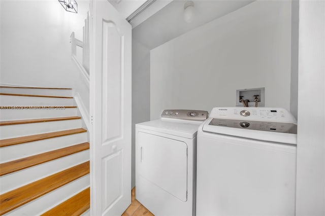 laundry room with laundry area and separate washer and dryer