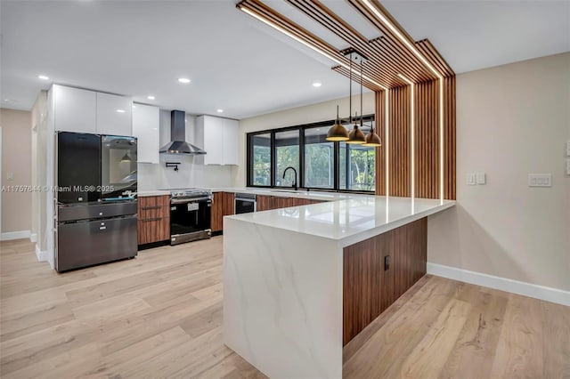 kitchen featuring modern cabinets, wall chimney range hood, a peninsula, stainless steel range with electric stovetop, and smart refrigerator