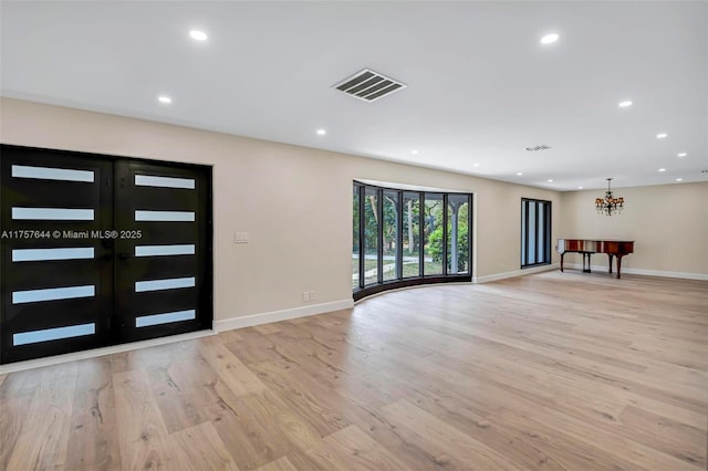 entrance foyer featuring recessed lighting, french doors, visible vents, and light wood finished floors