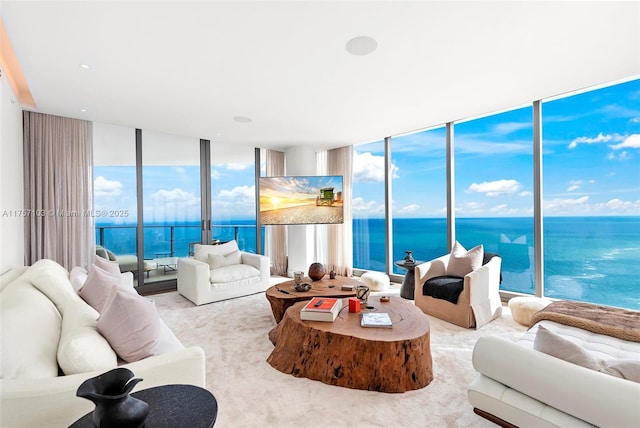 carpeted living room featuring floor to ceiling windows