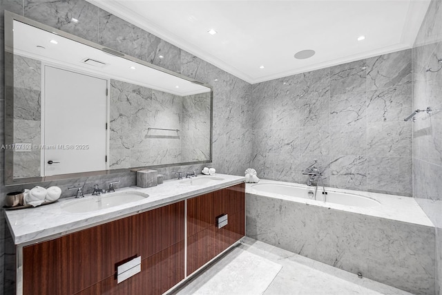 bathroom with ornamental molding, a sink, tile walls, and double vanity