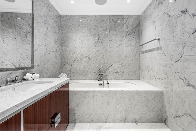 bathroom featuring tile walls, crown molding, vanity, and a bath