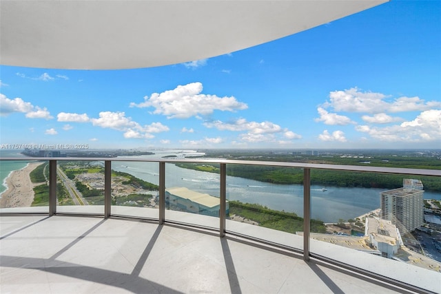 balcony featuring a water view