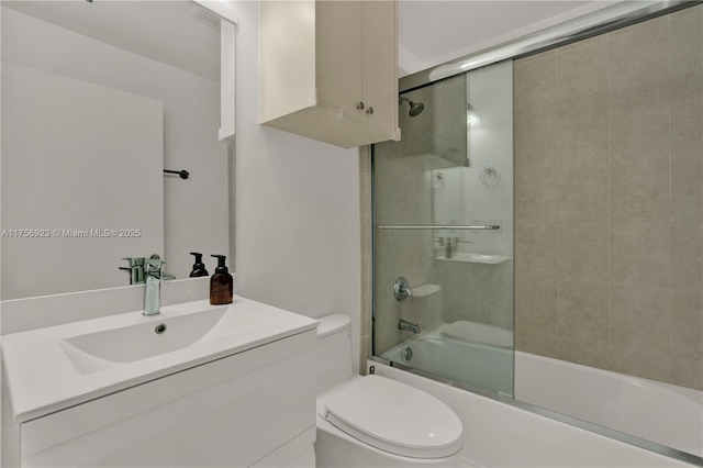 bathroom with visible vents, enclosed tub / shower combo, vanity, and toilet