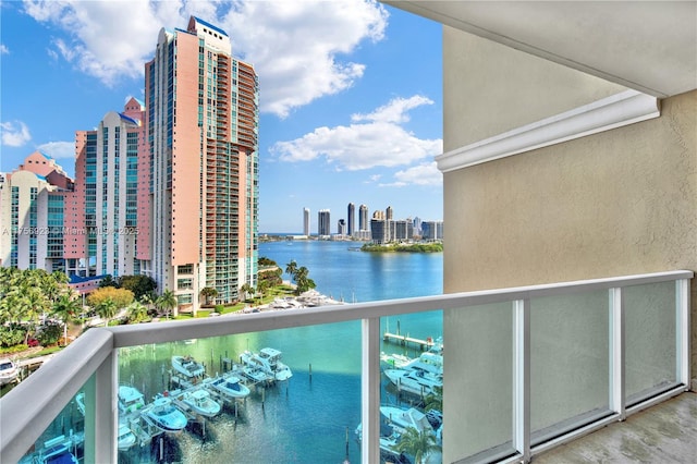 balcony featuring a view of city and a water view