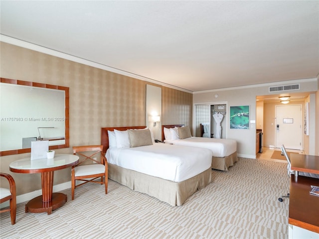 bedroom featuring baseboards, crown molding, visible vents, and wallpapered walls