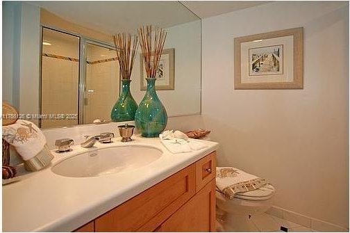 bathroom featuring vanity and toilet