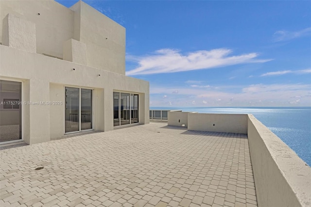 view of patio / terrace featuring a water view