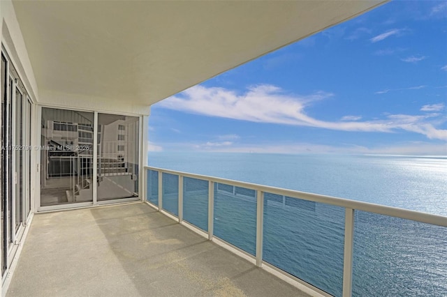 balcony featuring a water view and a sunroom