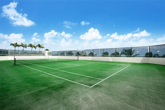 view of sport court featuring fence