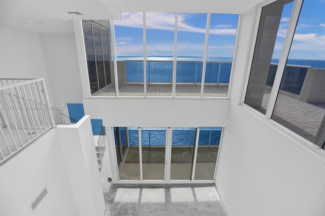 interior space featuring a water view and visible vents