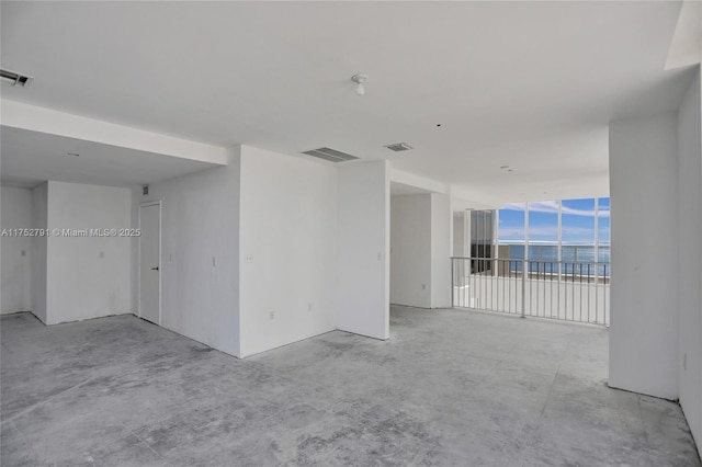 spare room with visible vents and concrete floors