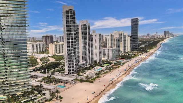 view of city featuring a water view and a beach view