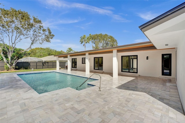 view of pool with a patio area, a fenced backyard, and a fenced in pool