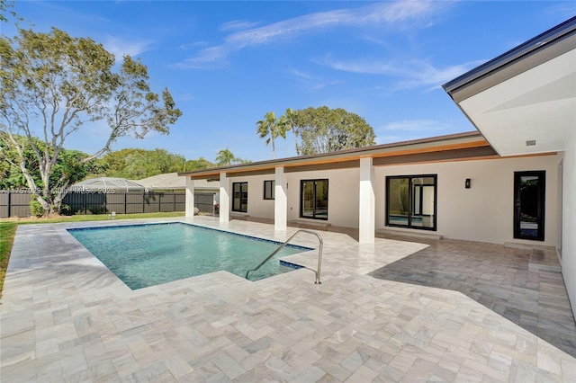 view of pool featuring a patio area, a fenced backyard, and a fenced in pool