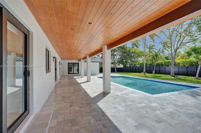 view of pool featuring a fenced in pool, a fenced backyard, and a patio