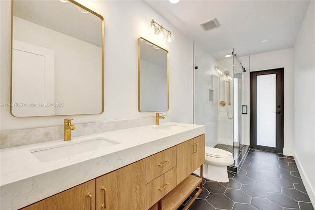 full bathroom featuring toilet, tile patterned flooring, a sink, and visible vents