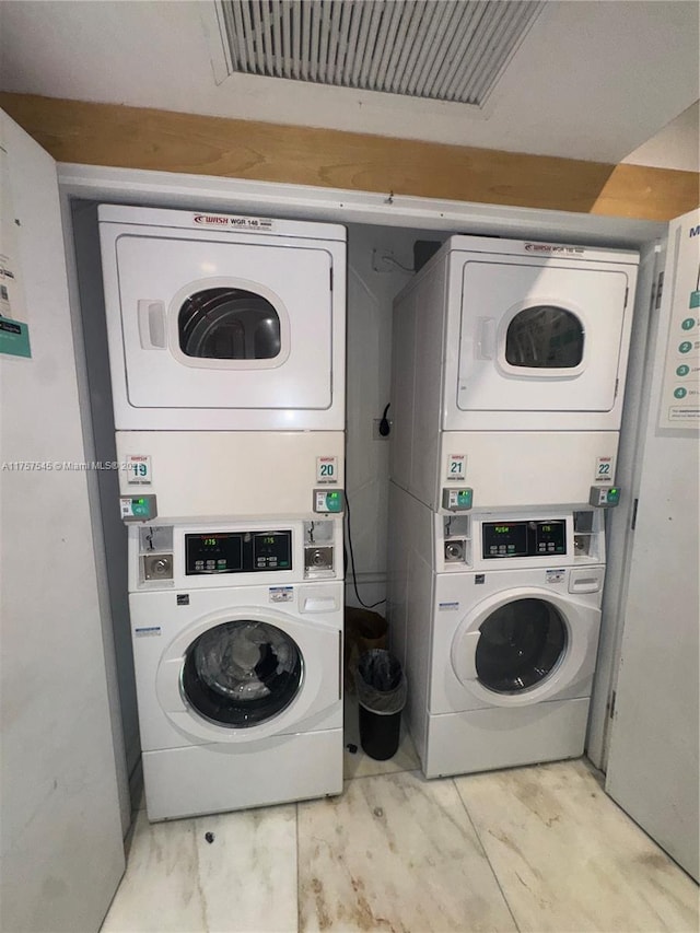 shared laundry area with stacked washer / dryer