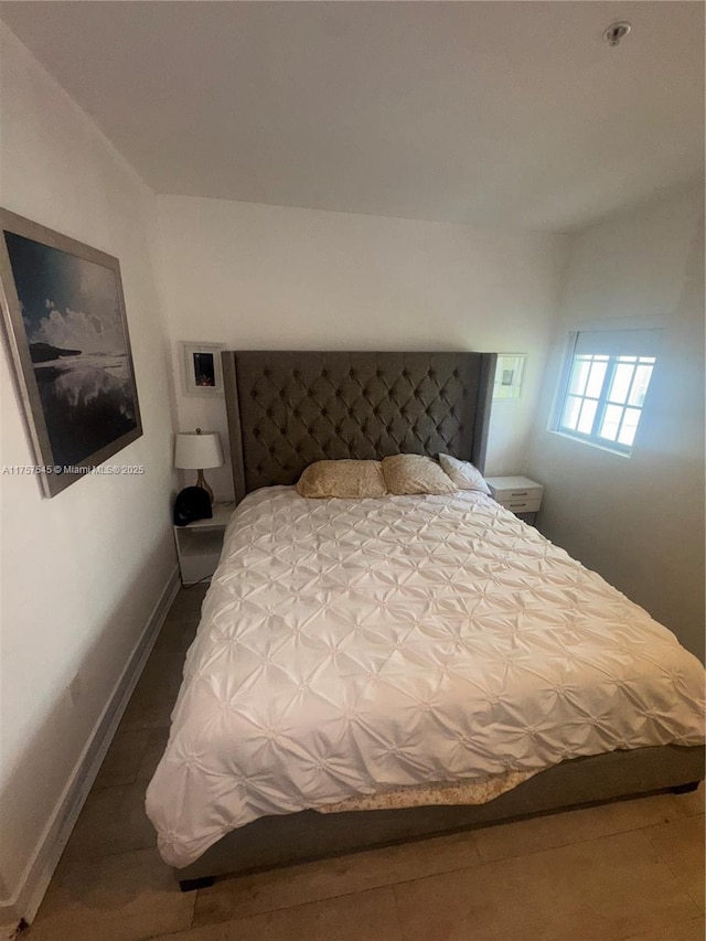 bedroom featuring baseboards