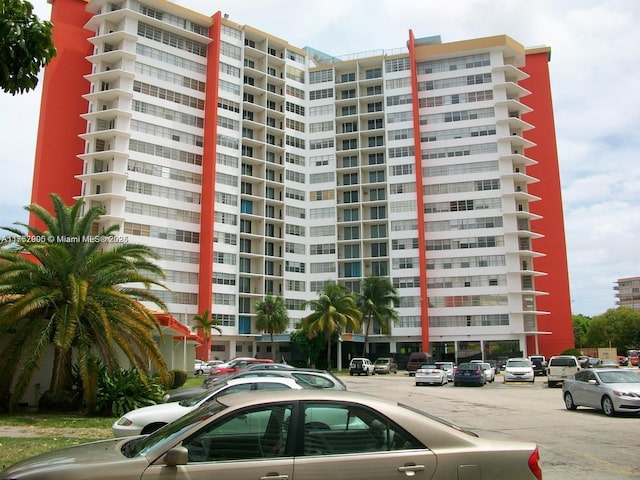 view of property featuring uncovered parking