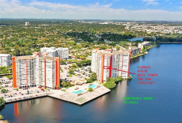 drone / aerial view with a water view and a city view