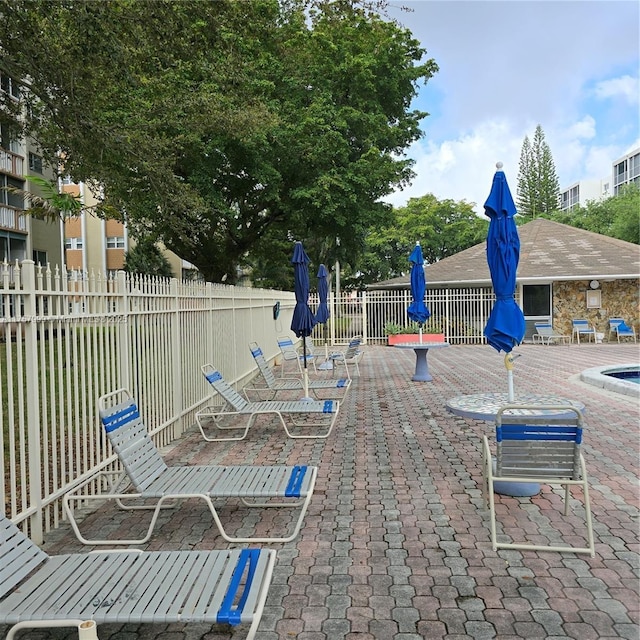 view of patio featuring fence