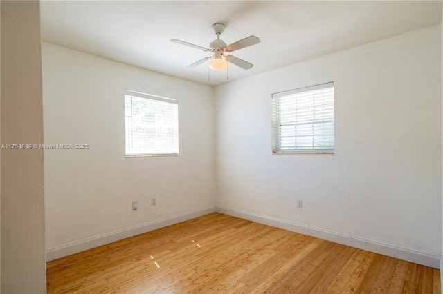 unfurnished room featuring light wood finished floors, baseboards, and a ceiling fan