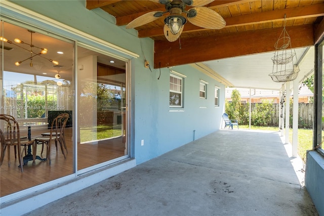 view of patio with fence and a ceiling fan