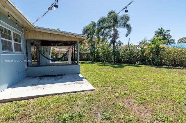 view of yard featuring a patio and fence