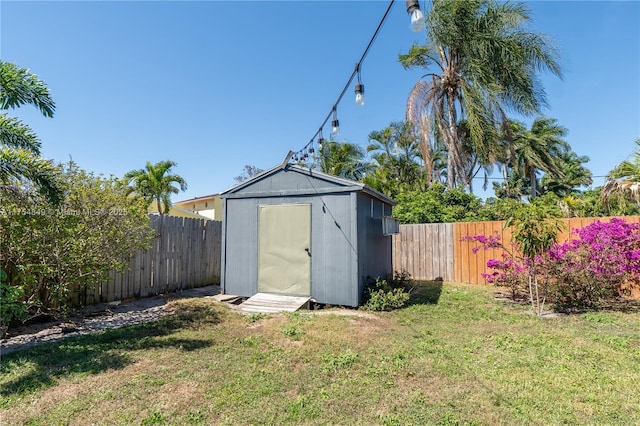 view of shed featuring a fenced backyard