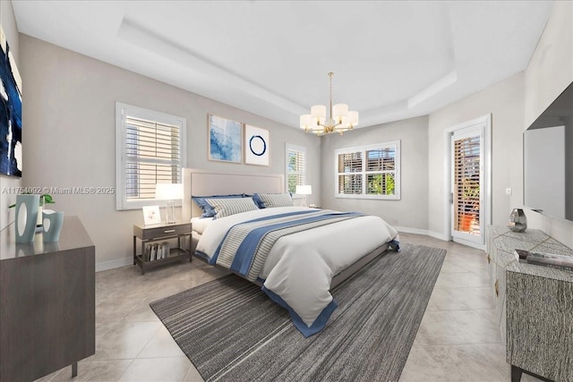 bedroom with a notable chandelier, light tile patterned floors, a raised ceiling, access to outside, and baseboards