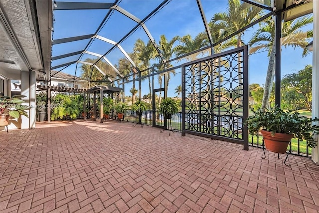 view of patio / terrace featuring glass enclosure