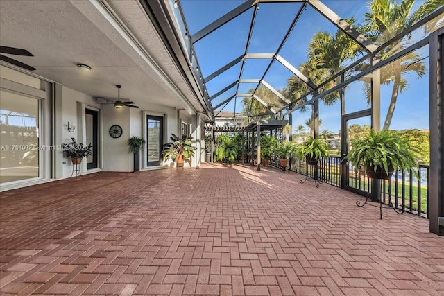 view of patio / terrace with glass enclosure and ceiling fan