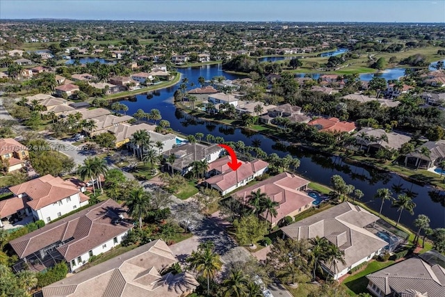 bird's eye view featuring a water view and a residential view