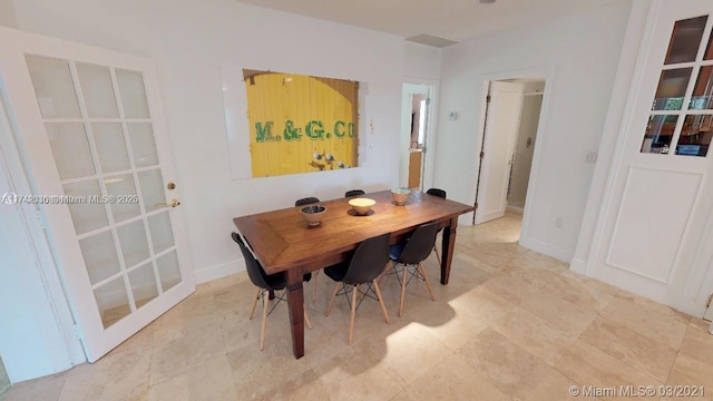 dining space featuring baseboards