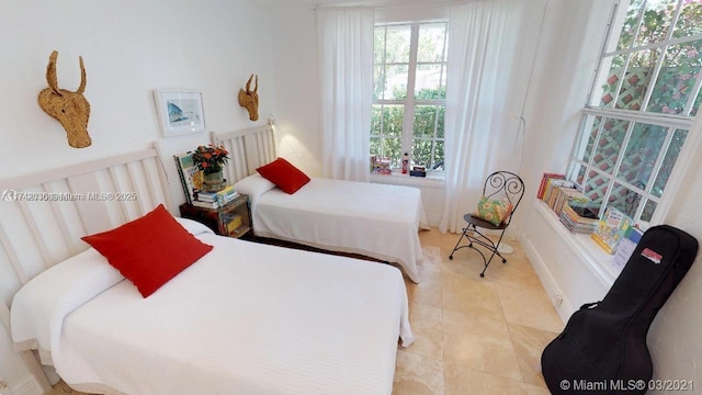 bedroom featuring light tile patterned floors