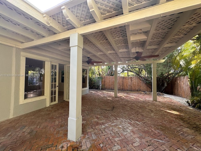 view of patio / terrace featuring ceiling fan and fence