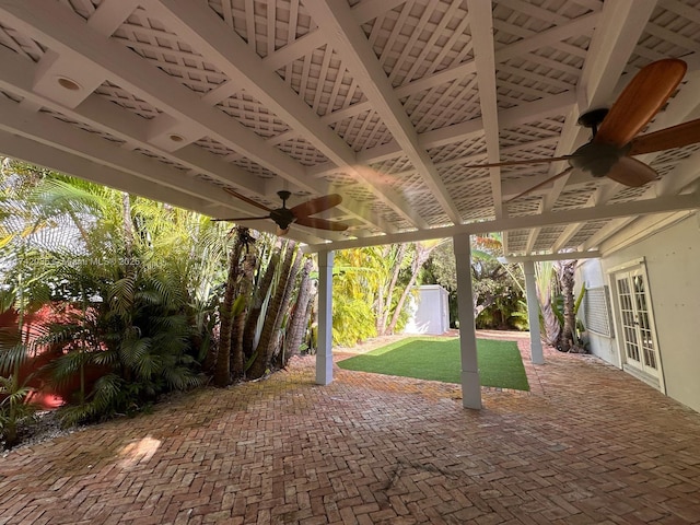 view of patio / terrace featuring an outbuilding, french doors, and a ceiling fan