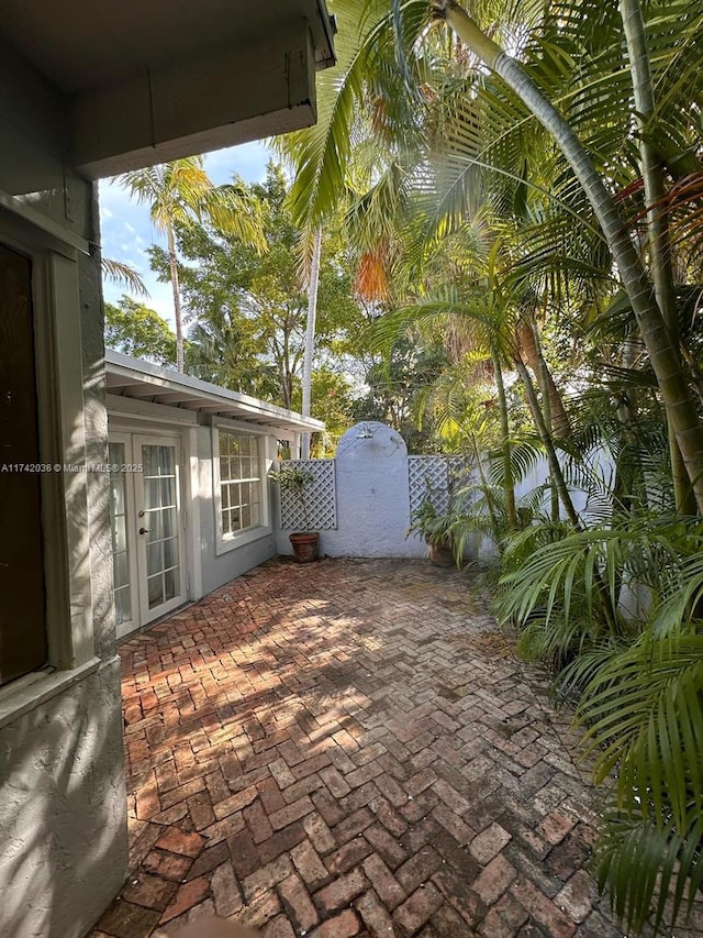 view of patio featuring a gate and french doors