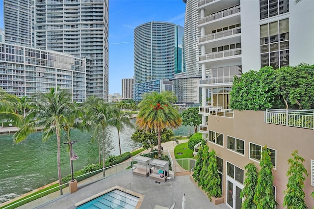 exterior space with a water view and a view of city