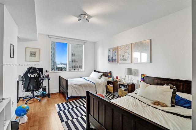 bedroom featuring light wood-style floors