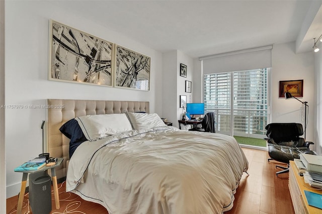 bedroom with wood finished floors